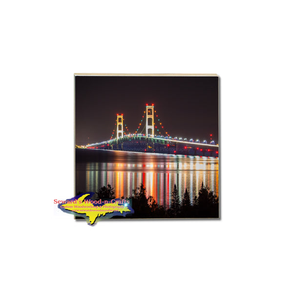 A nightly reflection of the Mackinac Bridge on a vivid tile coaster